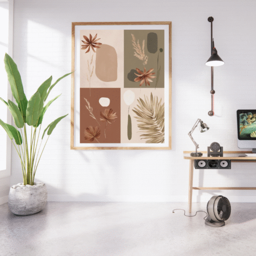Modern boho botanical wall art with earthy abstract floral and leaf designs in a wooden frame, displayed in a bright minimalist home office with a potted plant, wooden desk, and white brick wall.