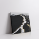 Modern abstract volcanic landscape wall art in a stretched canvas, featuring deep black textures, white glacier-like streaks, and shimmering metallic gold accents—luxury canvas print inspired by Icelandic terrain, perfect for bold, minimalist, Japandi, and high-contrast interiors. Ideal for statement wall decor and earthy-luxe aesthetics.