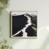 Modern abstract volcanic landscape wall art featuring deep black textures, white glacier-like streaks, and shimmering metallic gold accents—luxury canvas print inspired by Icelandic terrain, perfect for bold, minimalist, Japandi, and high-contrast interiors. Ideal for statement wall decor and earthy-luxe aesthetics.