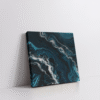 Aerial abstract ocean wall art in a stretched canvas featuring soft turquoise, sky blue, and white water textures—calming coastal canvas print perfect for beach-inspired, airy, and minimal interiors.