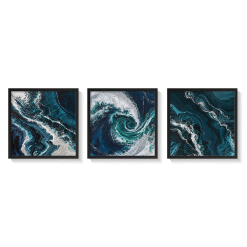 Set of 3 abstract Pacific Ocean paintings in shades of blue and white, featuring fluid wave patterns and framed in sleek black frames.