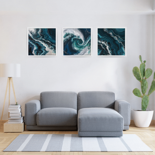 Set of 3 abstract Pacific Ocean paintings in shades of blue and white, featuring fluid wave patterns and framed in beautiful frames