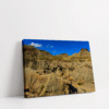 Horizontal stretched canvas view of Alberta’s Badlands with wide rock valleys and dramatic desert-like scenery.