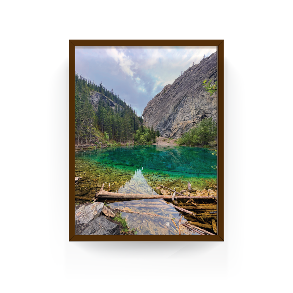 Espresso-framed Grassi Lake print featuring mountain reflections and forest backdrop in Canmore.