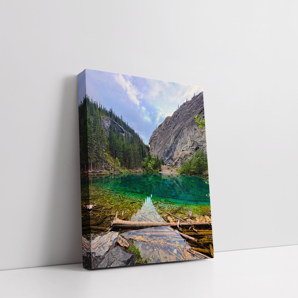 Stretched canvas print of Grassi Lake in Canmore, showcasing turquoise waters and surrounding peaks.