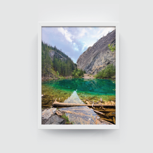 White-framed photograph of Grassi Lake’s vivid turquoise waters and alpine scenery in Canmore.