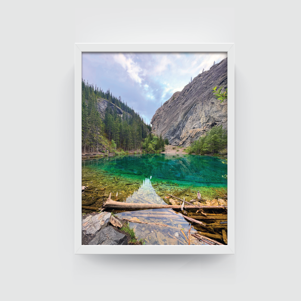 White-framed photograph of Grassi Lake’s vivid turquoise waters and alpine scenery in Canmore.