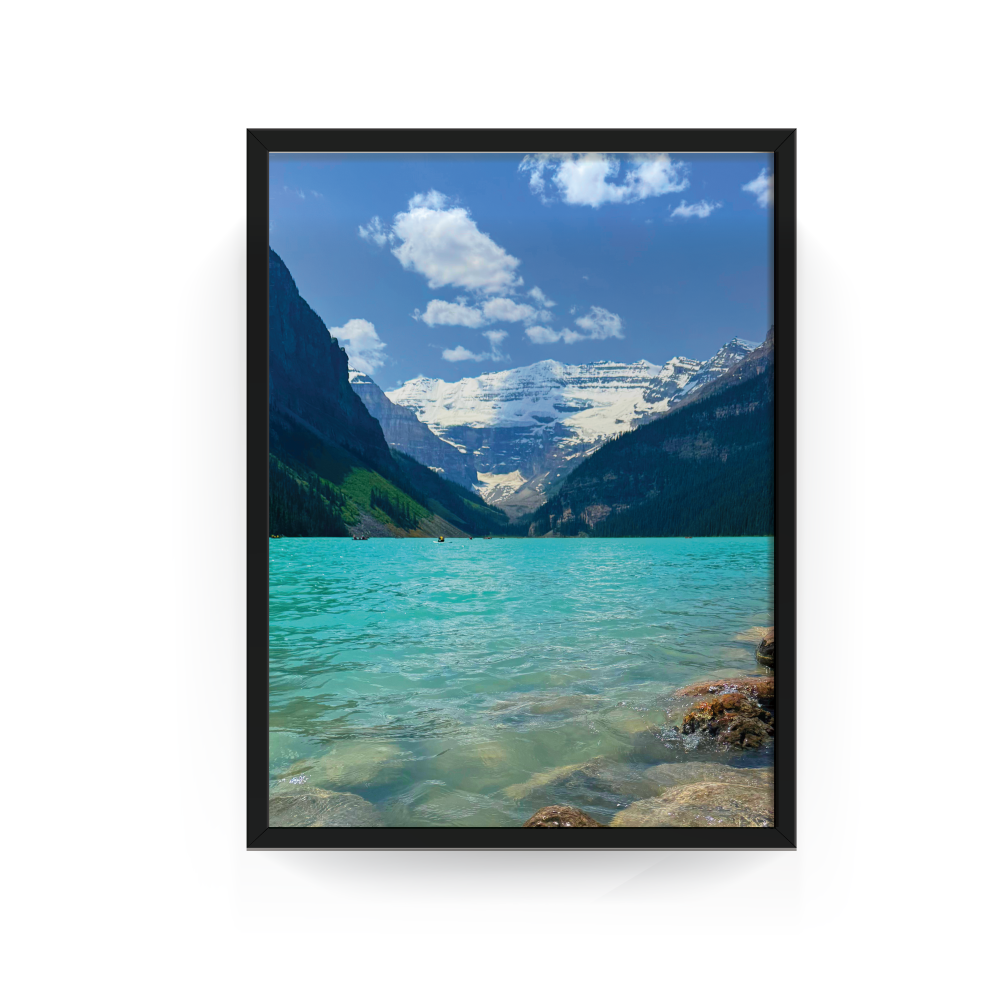 Black-framed photograph of turquoise Lake Louise with mountain backdrop in Banff National Park.