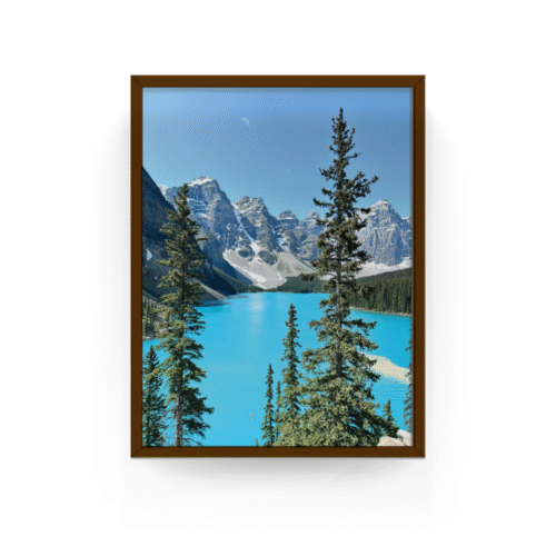 Vertical Lake Moraine Alberta print with espresso frame capturing the golden light on rocky peaks