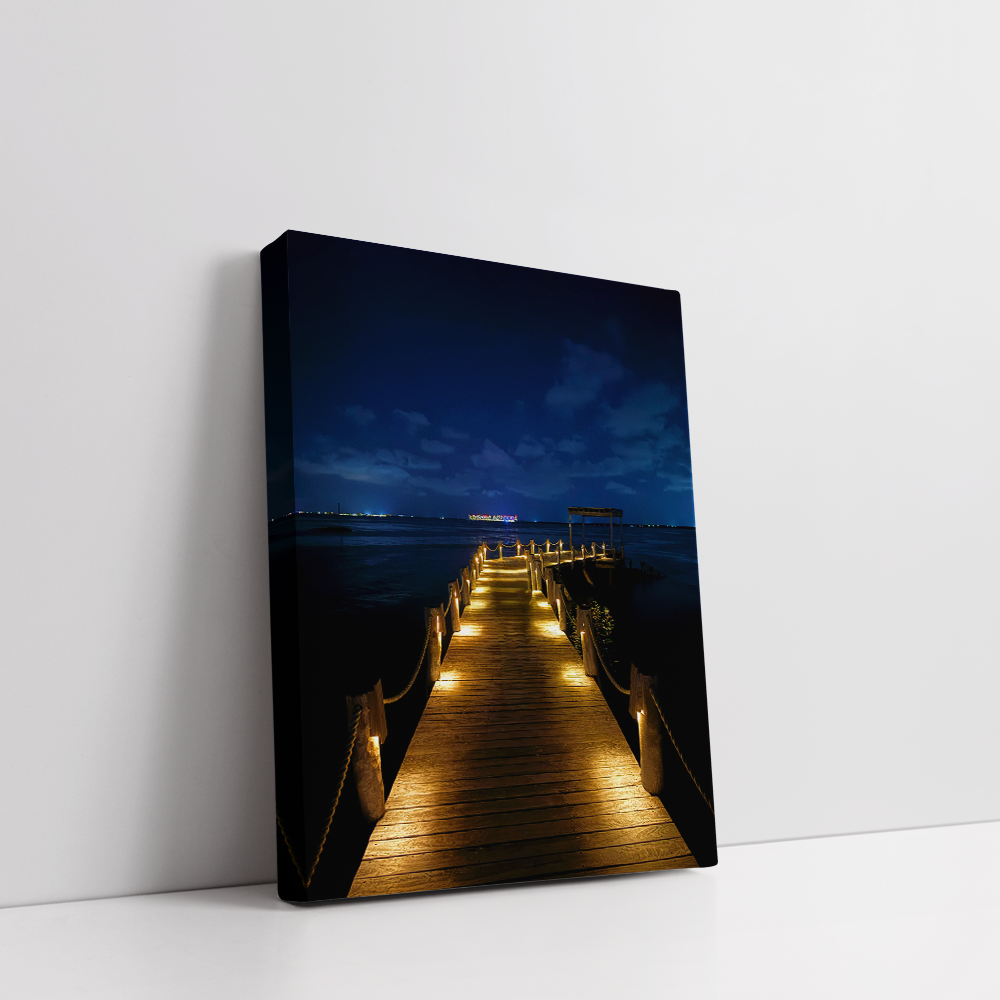 Stretched canvas night photography of Nizuc Resort pier over the Caribbean Sea.