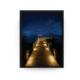 Black-framed night photograph of illuminated wooden pier over the Caribbean Sea at Nizuc Resort.