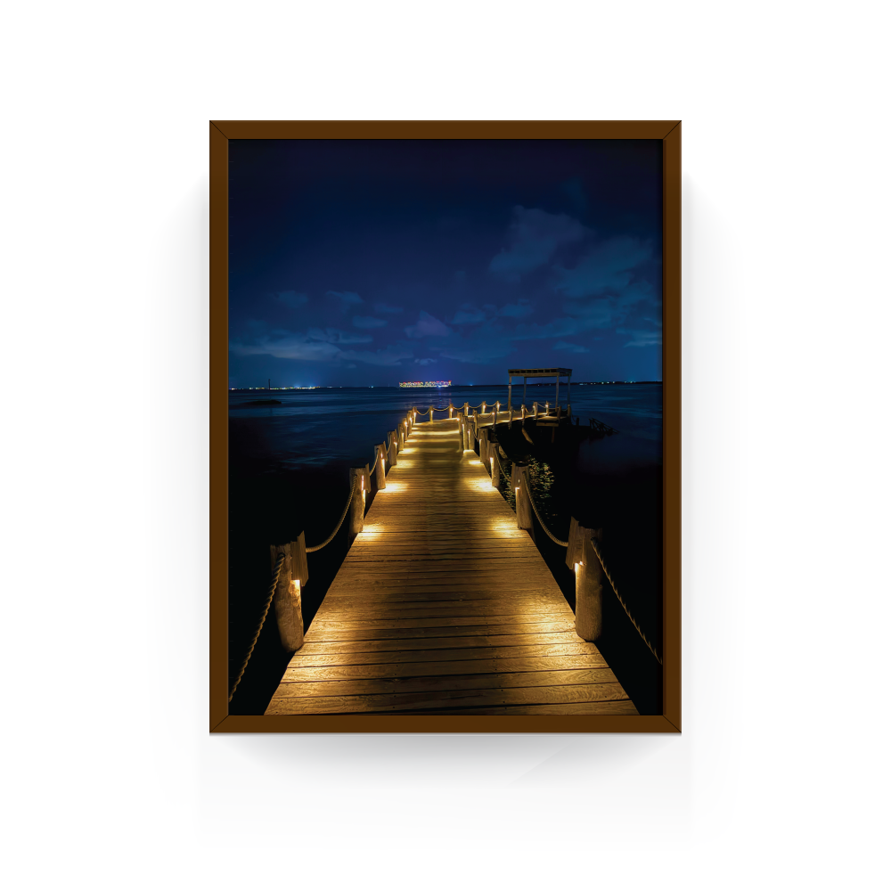 Espresso-framed Caribbean night pier print with glowing lights and ocean backdrop, Nizuc Resort.