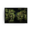 Nizuc Resort Cancun night photography in a sleek black frame, showing illuminated trees reflected on a calm pond with deep greens and soft lighting.