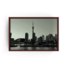 Espresso-framed monochrome Toronto skyline photo featuring CN Tower, Rogers Centre, and Ontario lake waters.