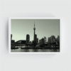 White-framed black and white Toronto skyline print with CN Tower, Rogers Centre, and lake foreground.
