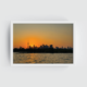 Toronto skyline at sunset photograph in a crisp white frame, highlighting warm orange and purple skies over downtown Toronto and the CN Tower waterfront view.