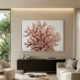 Coral reef botanical canvas wall art hanging above a dark sideboard in a luxury neutral living room, large-scale terracotta and dusty rose coral painting in a blonde wood float frame, organic modern coastal interior