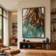 Mangrove tree roots canvas wall art hanging above a walnut shelving unit in a mid-century modern study, large-scale tropical nature painting in a black float frame, warm rust and teal tones, Eames lounge chair interior